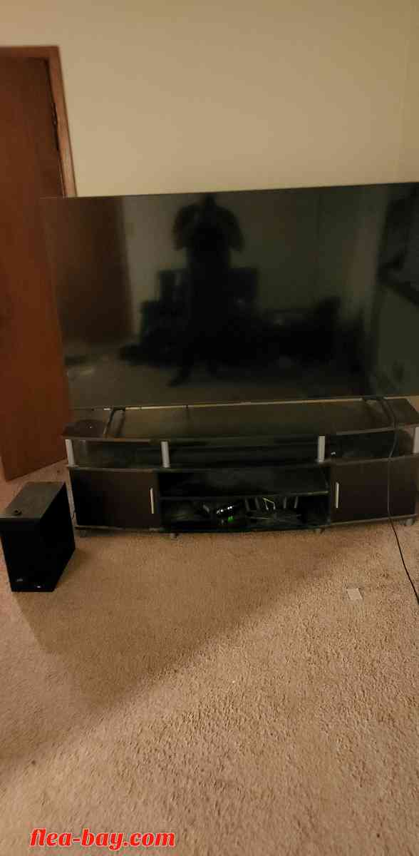 75in tv with entertainment center and soundbar with subwoofe
