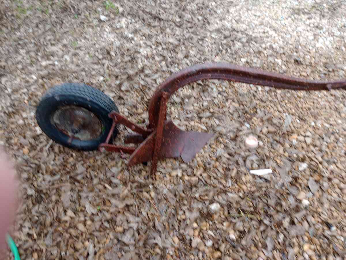 old pull behind plow