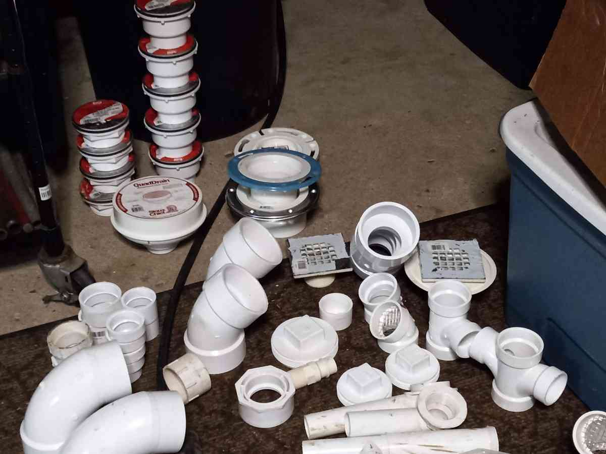 lots of home plumbing parts elbows and drains and couplings
