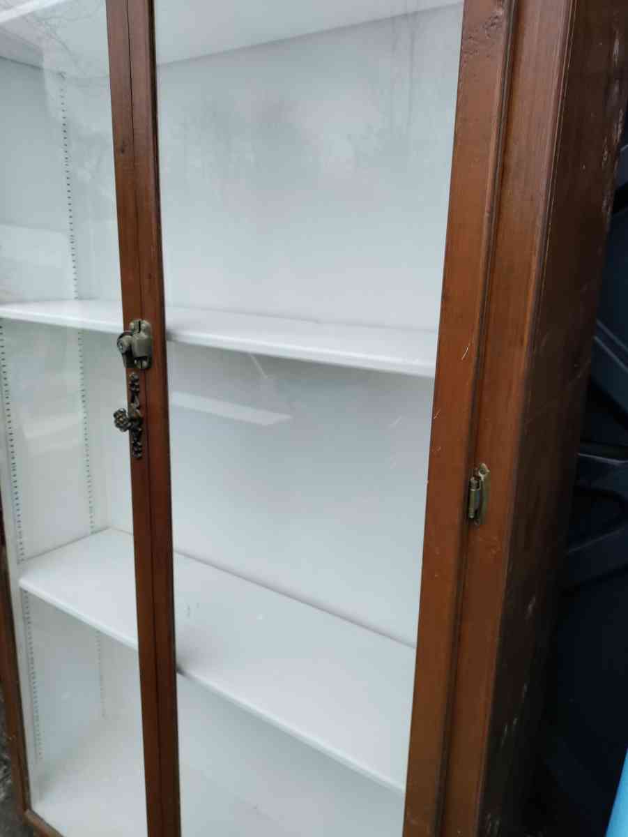 two very tall vanities or display cases