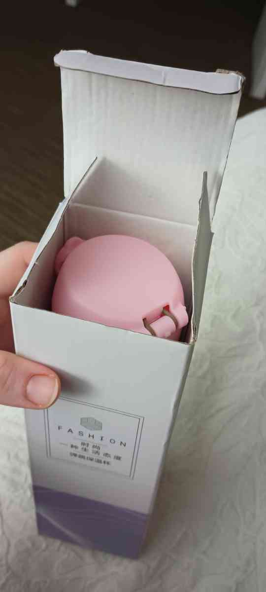 A steel drinking cup thermos