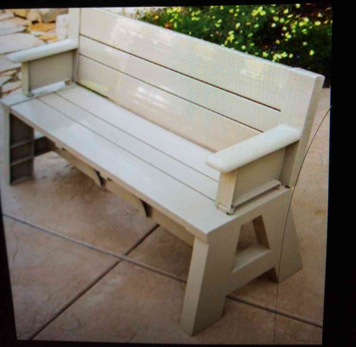 Cream colored wooden sturdy outdoor bench