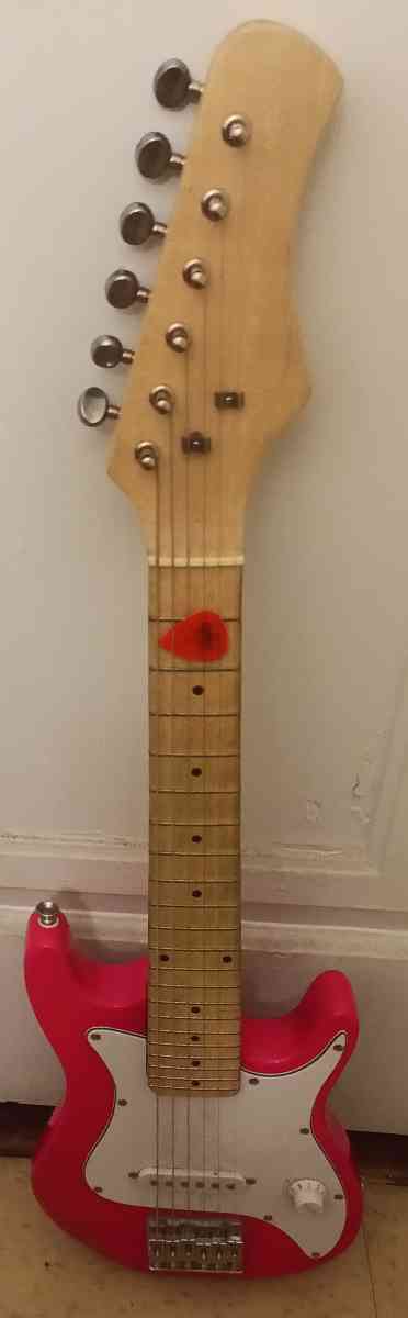 pink electric guitar with pick