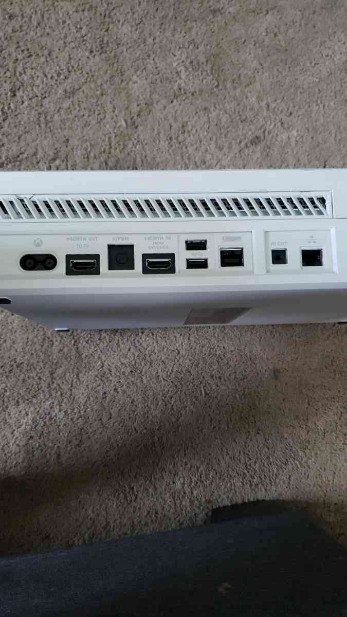 Xbox one with a wired controller and 3 games for the console