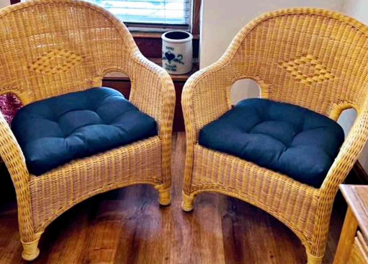 2 identical indoor or outdoor wicker chairs