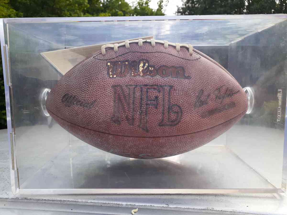 an autographed Ken Stabler football in an acrylic case