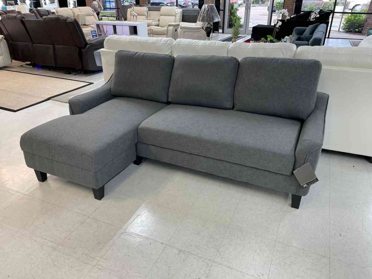Jarreau aShley Sleeper Sectional in stock  grey on display