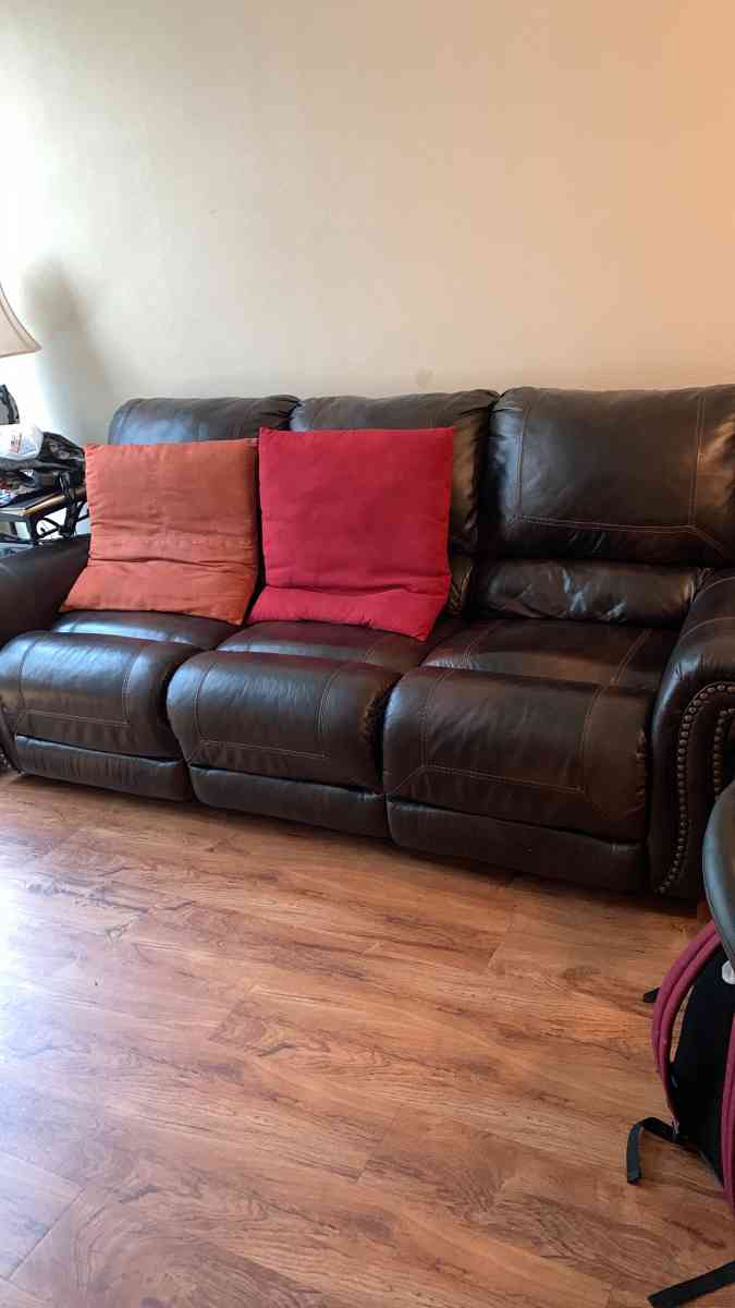 a couch a bed a dresser and a tv stand and a side table