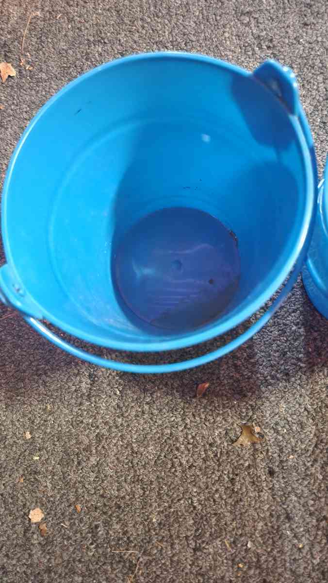 Small blue buckets perfect for pens on the desk