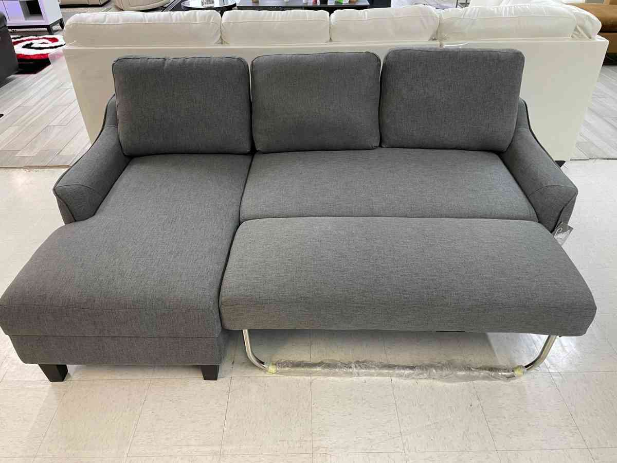 Jarreau aShley Sleeper Sectional in stock  grey on display