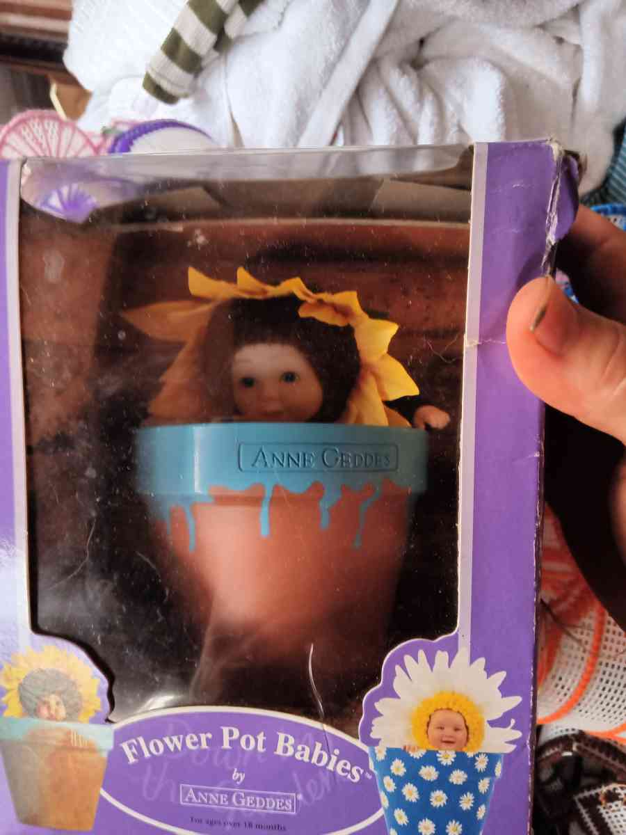 Anne geddes down in the garden flower pot baby