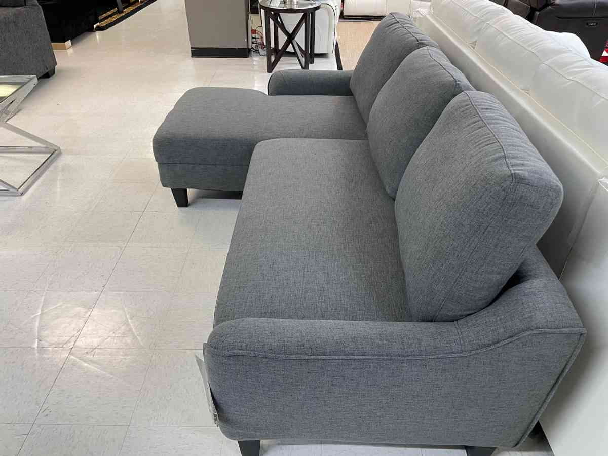 Jarreau aShley Sleeper Sectional in stock  grey on display