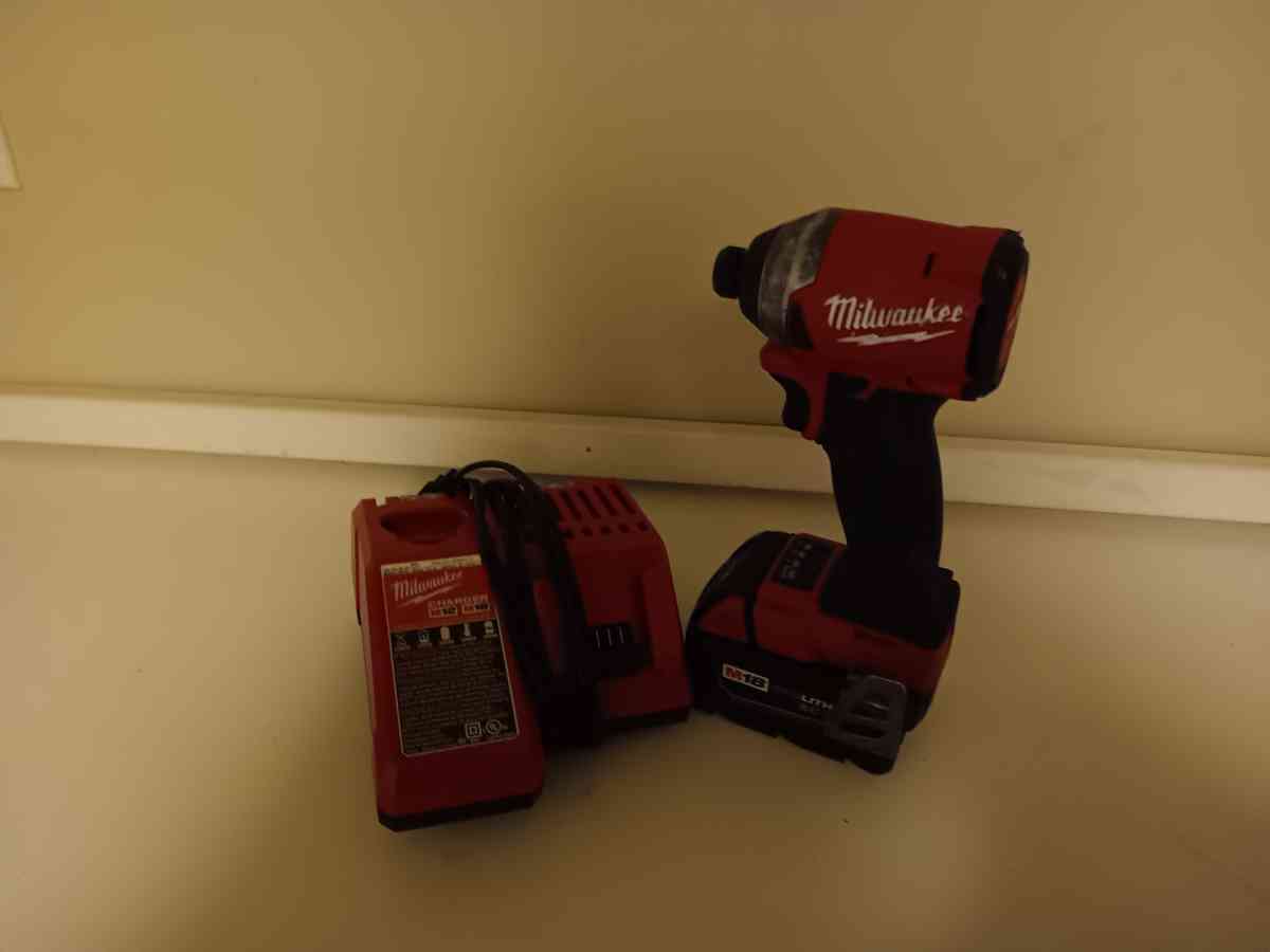 Milwaukee impact drill with battery and charger