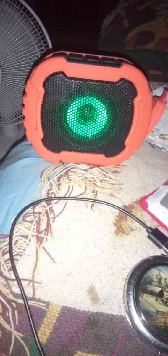 Orange Bluetooth speaker colored cross pendant