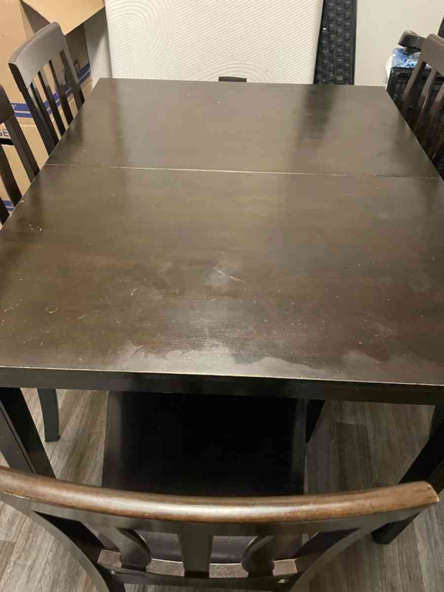 Table includes 5 chairs