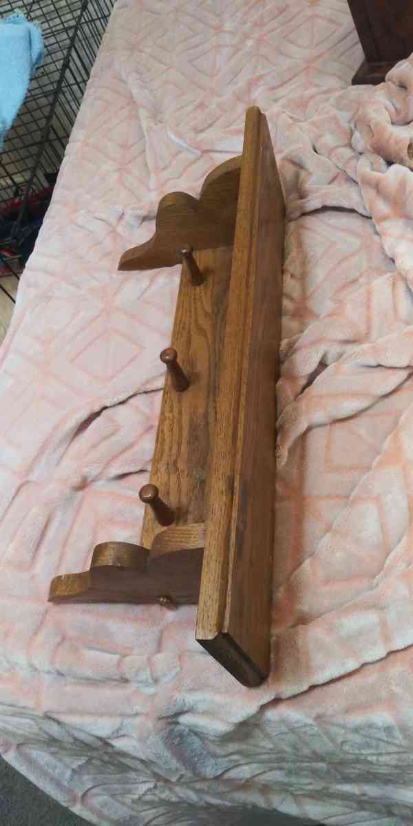 Brown shelf with knobs