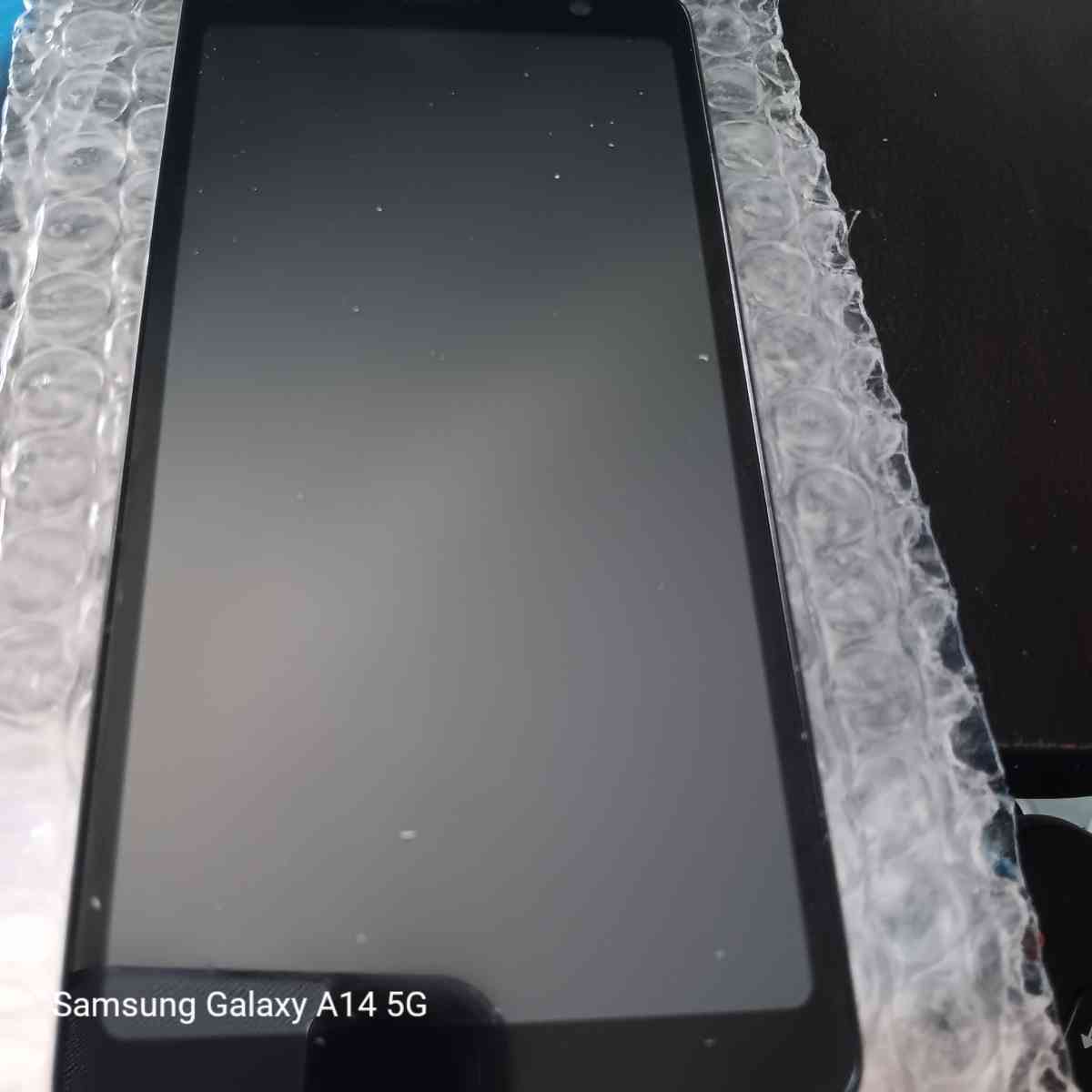 new black cell phone with charger