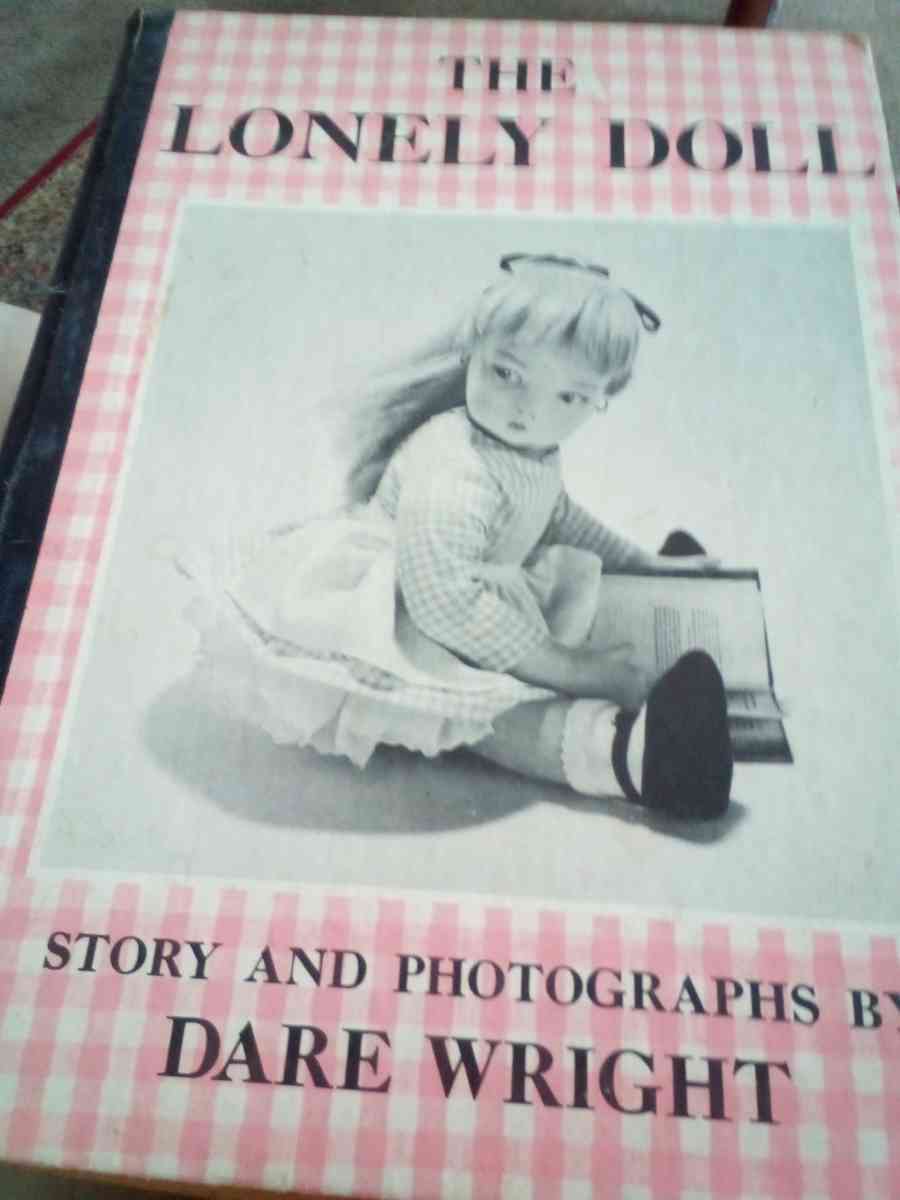 hard back book of the lonely doll story and photos by Dare w