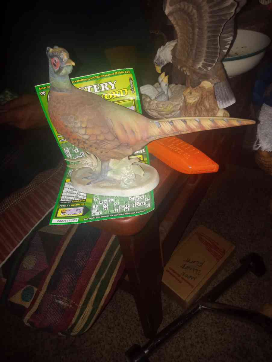 female pheasant statue