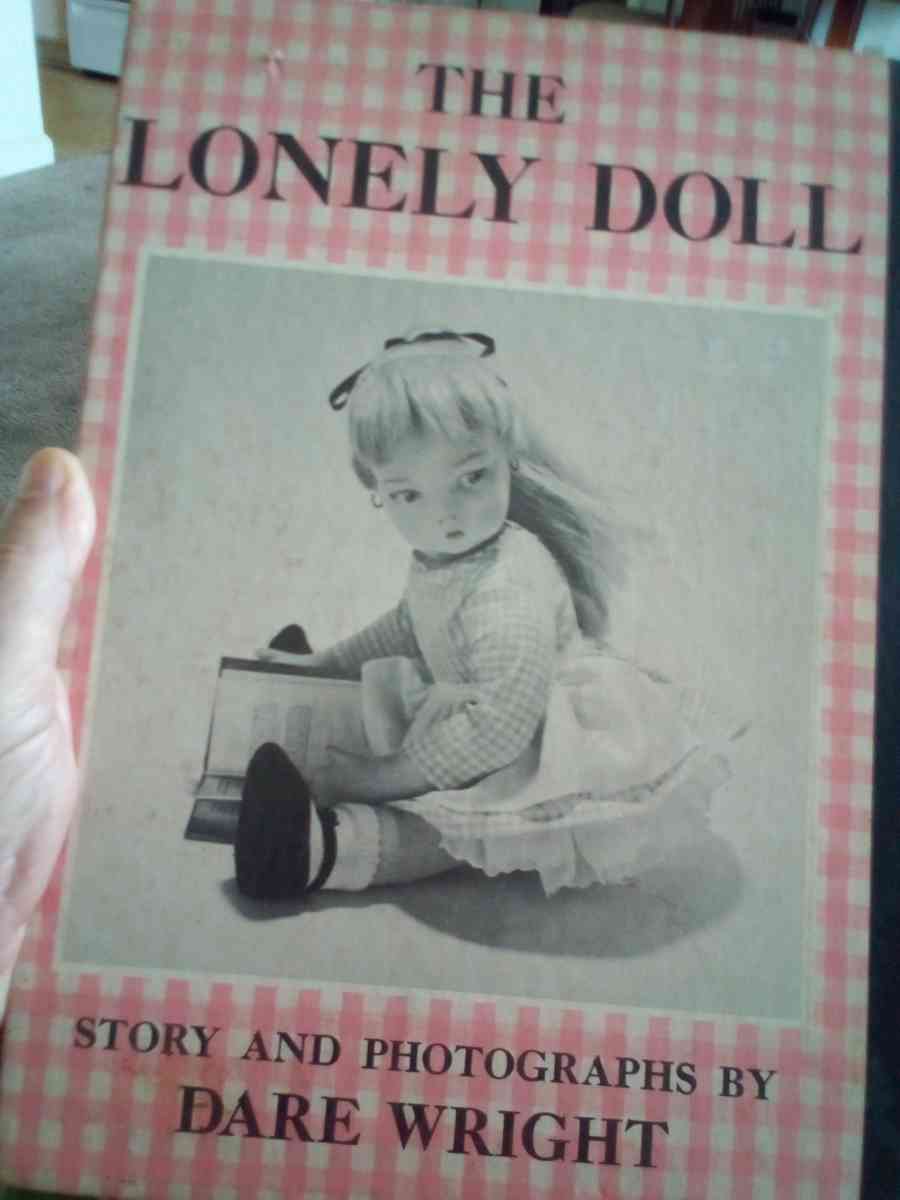 hard back book of the lonely doll story and photos by Dare w
