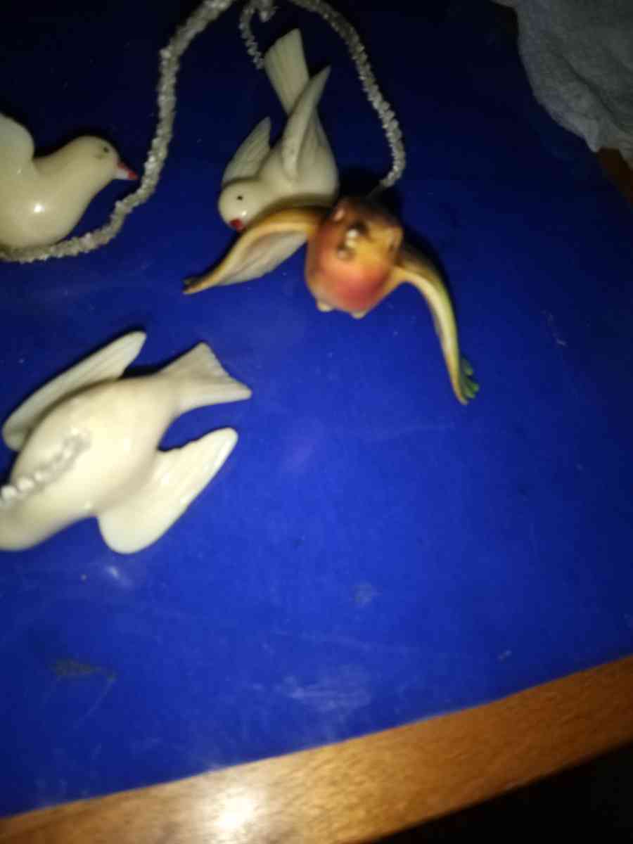 3 white and 1 airbrushed Lucite Birds