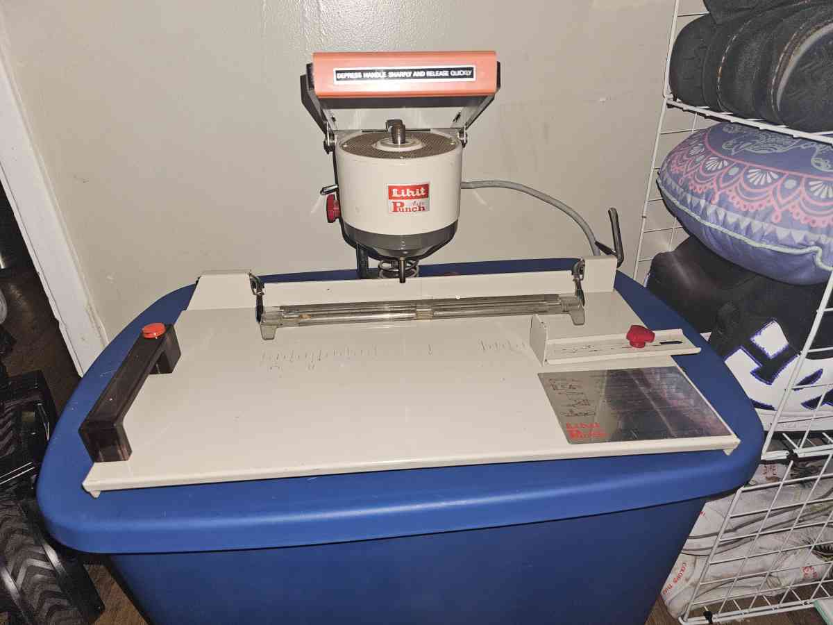A Lihit Electrical paper Hole Puncher Model 2001AA