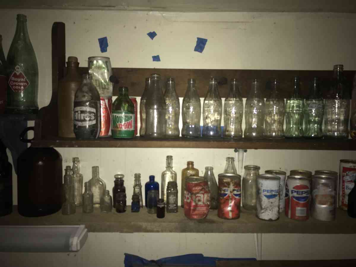 old soda bottles and beer bottles and others