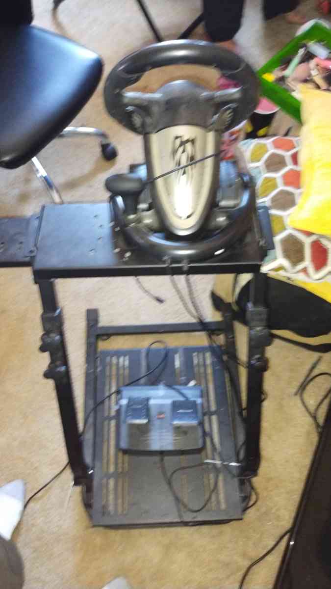 gaming chair and gaming steering wheel and pedals