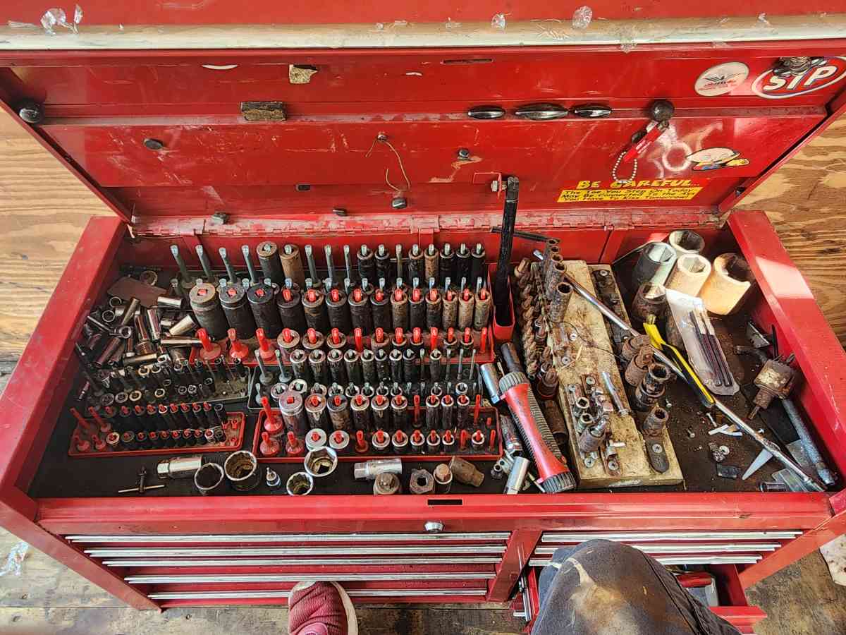 large top and bottom box full of tools