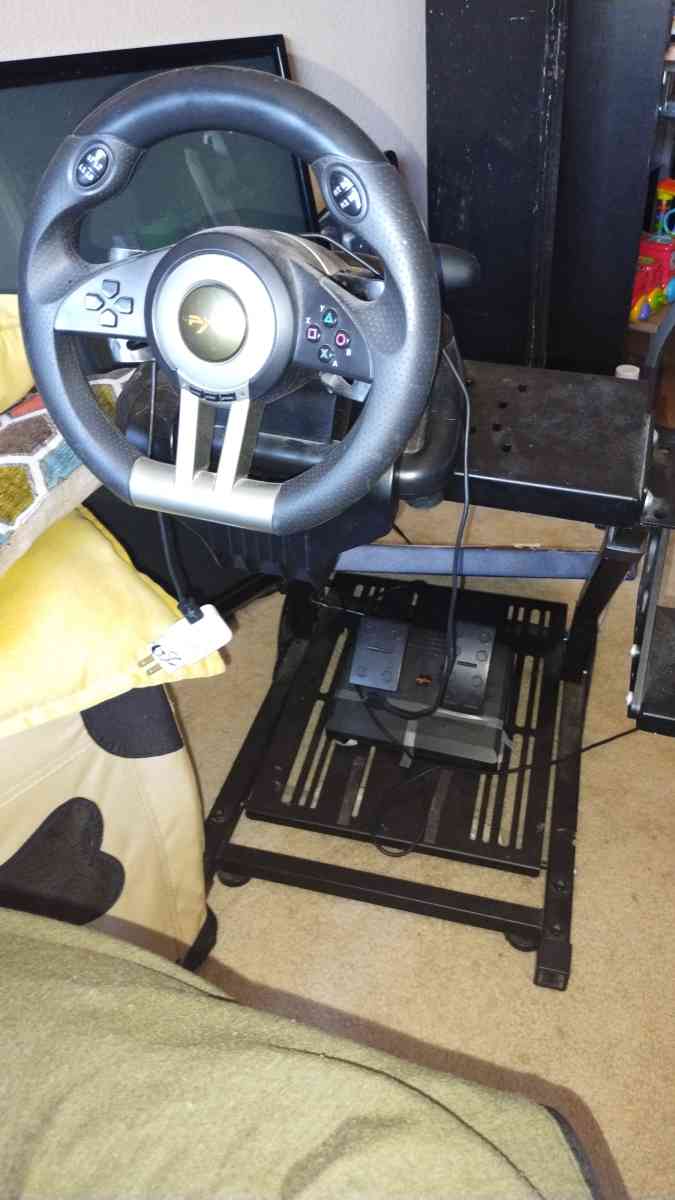 gaming chair and gaming steering wheel and pedals