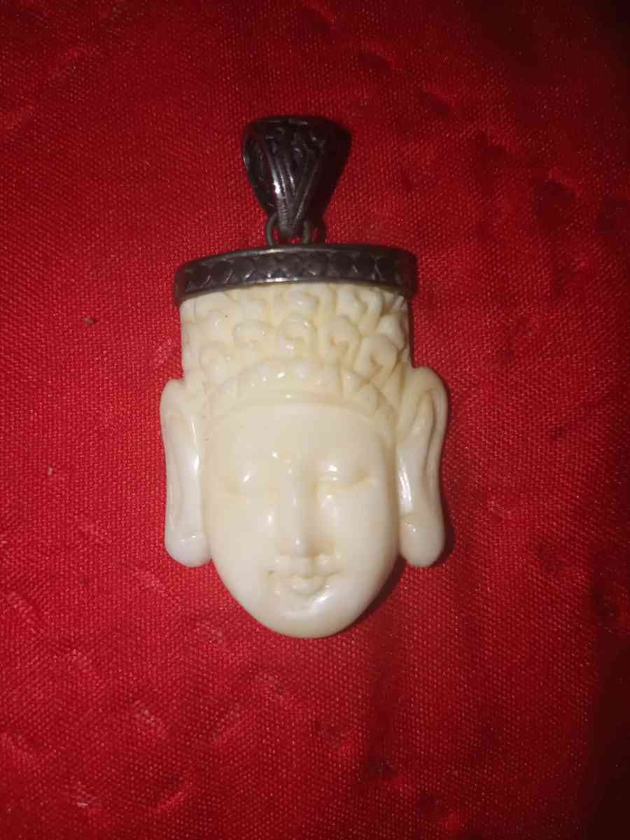 hand carved Buddha head pendant