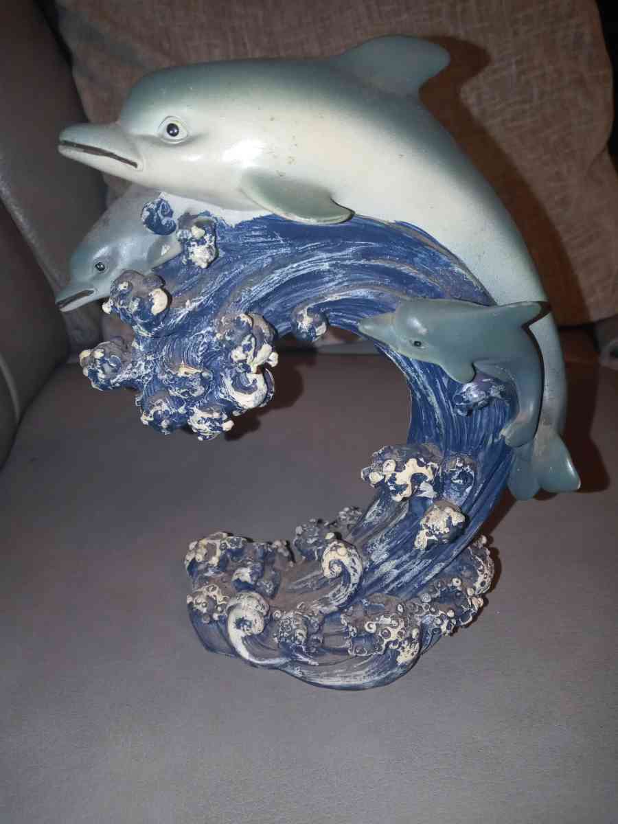 two dolphins in the ocean figurine