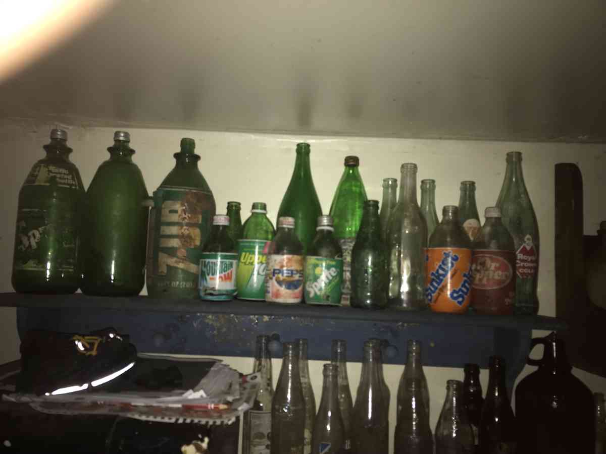 old soda bottles and beer bottles and others