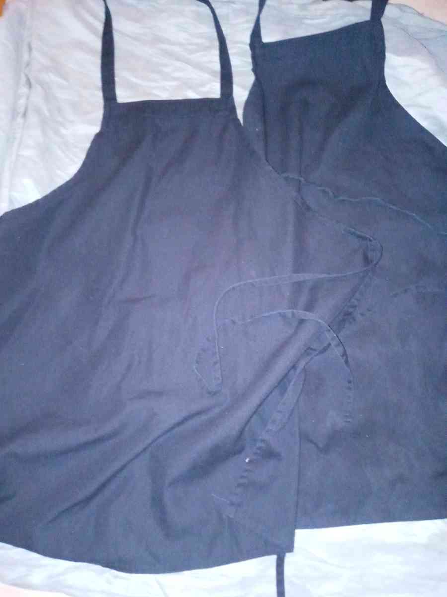 two black full aprons