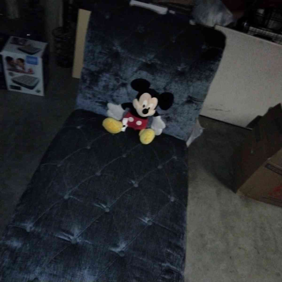 blue buttoned curvy tuffed sofa