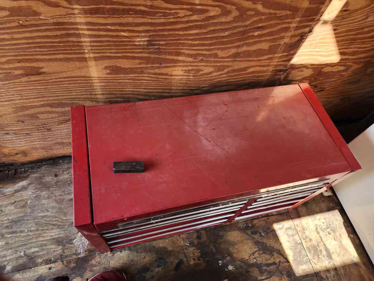 large top and bottom box full of tools