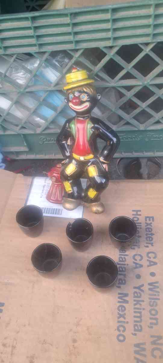 1950s black Americana hobo decanter with 5 shot glasses