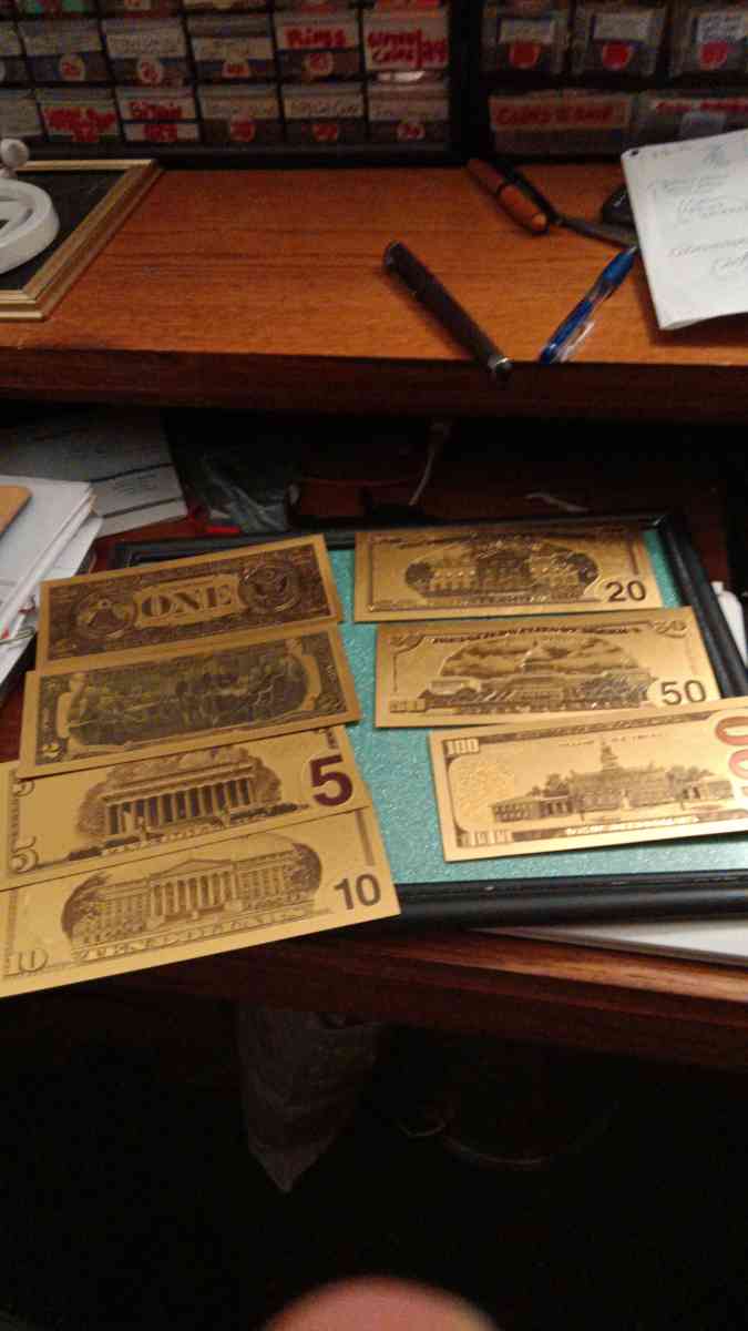 Set of Seven Commemorative Golden Bills covered with gold