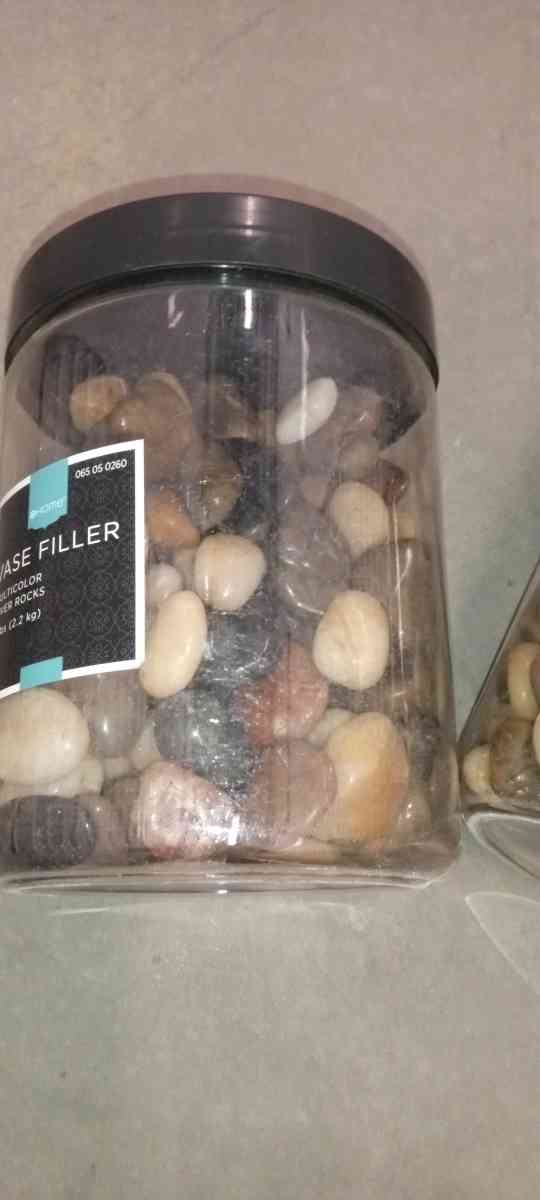 2 plastic boxes of river stones