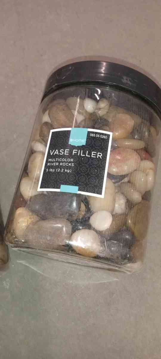 2 plastic boxes of river stones