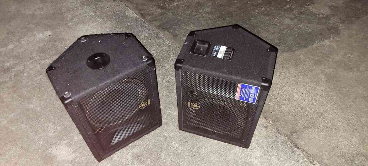 a Yamaha synthesizer and stage snake and speakers