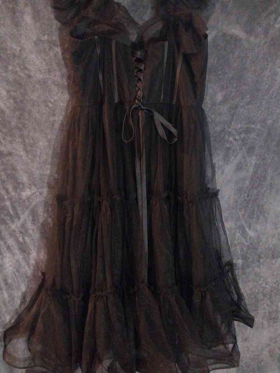 Corset style Corset is see thru around the bust