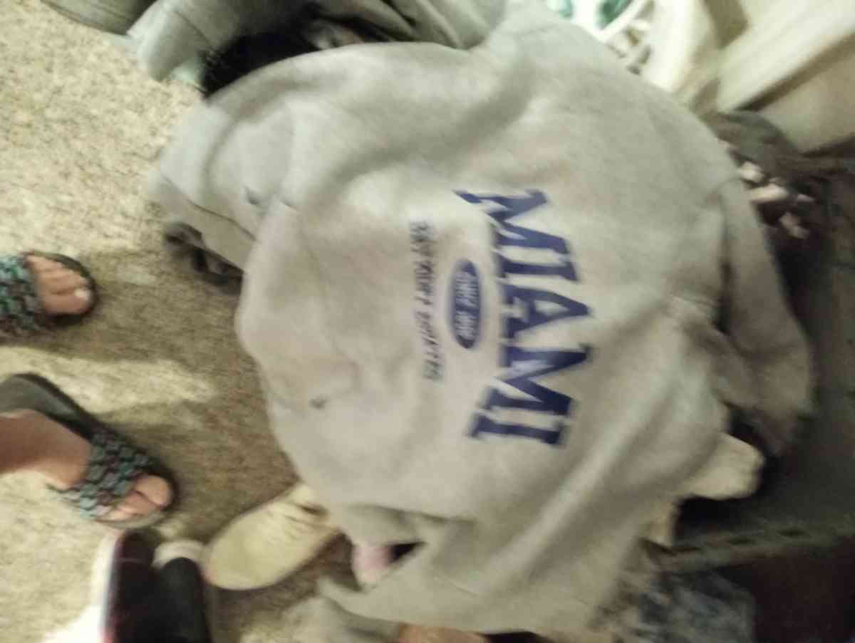 bucket full of gently worn clothing items size med to lrg