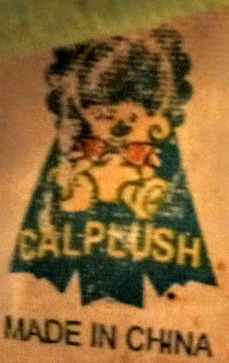 Orange Flower with Yellow Smiley Face and Green Bendable Ste