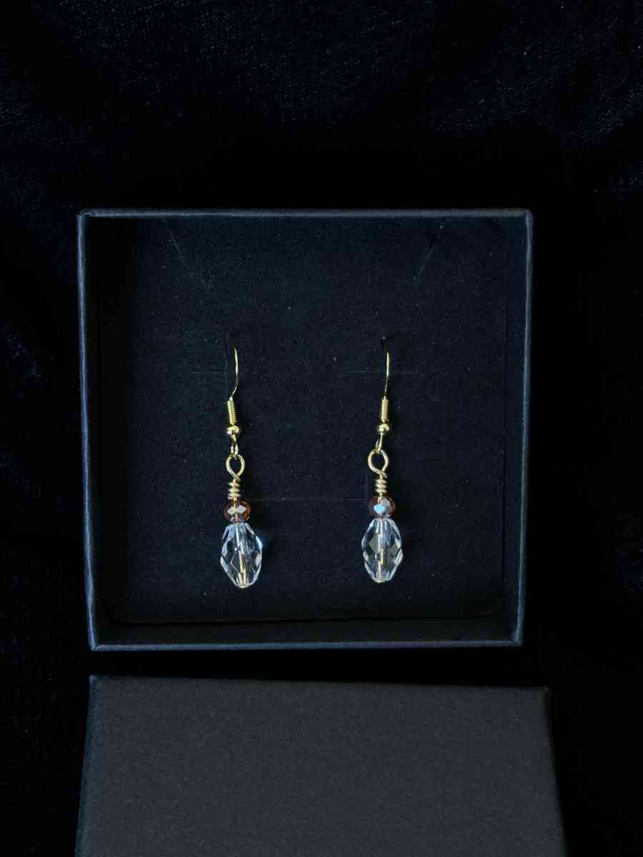 ambler and clear glass bead dangly earrings