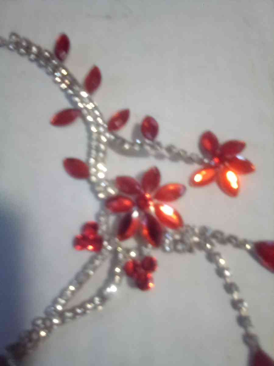 Orange hanging flower and gold necklace with diamonds