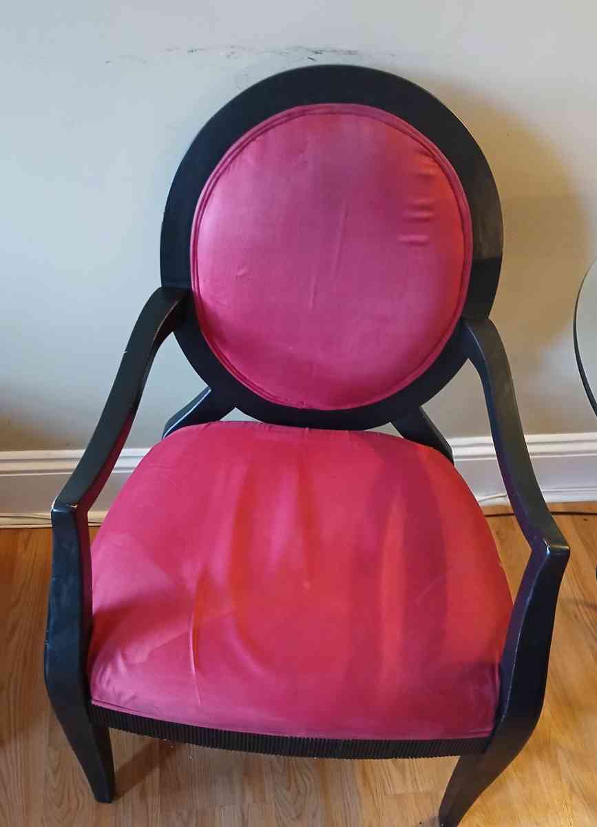 glass table with 2 red black vintage chairs