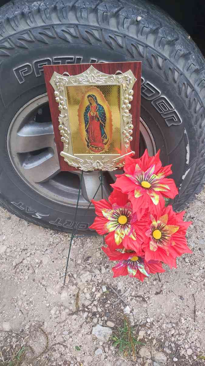 assorted flowers stands  virgin Mary pot