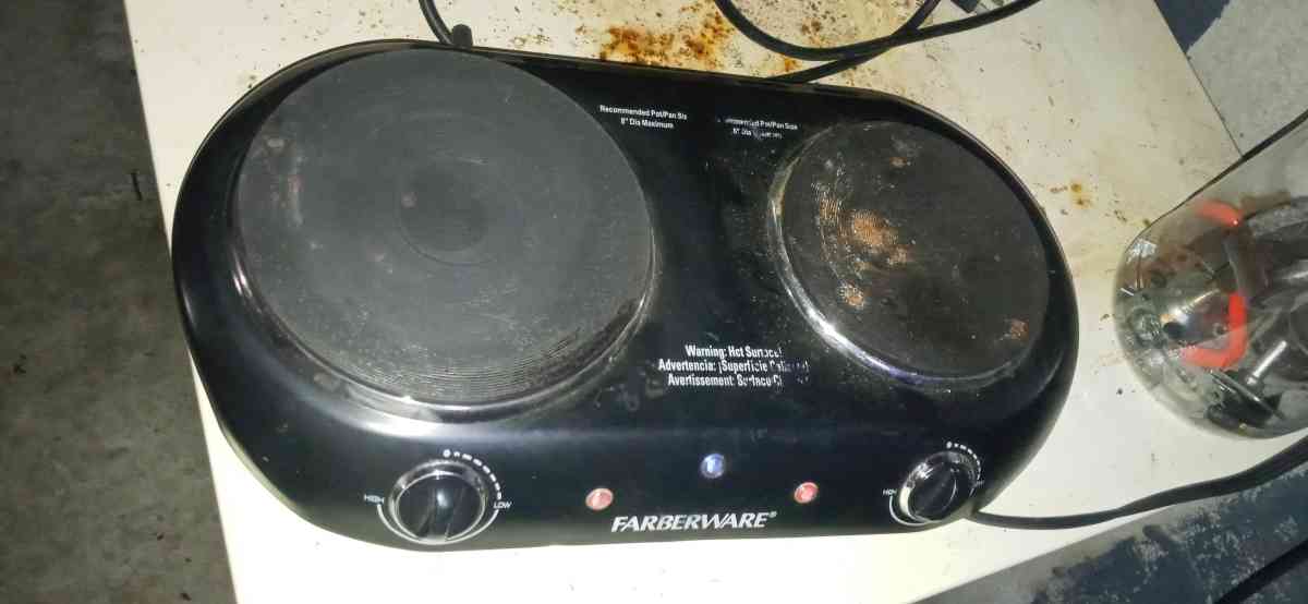 two pot plug in stove top and a flat skillet