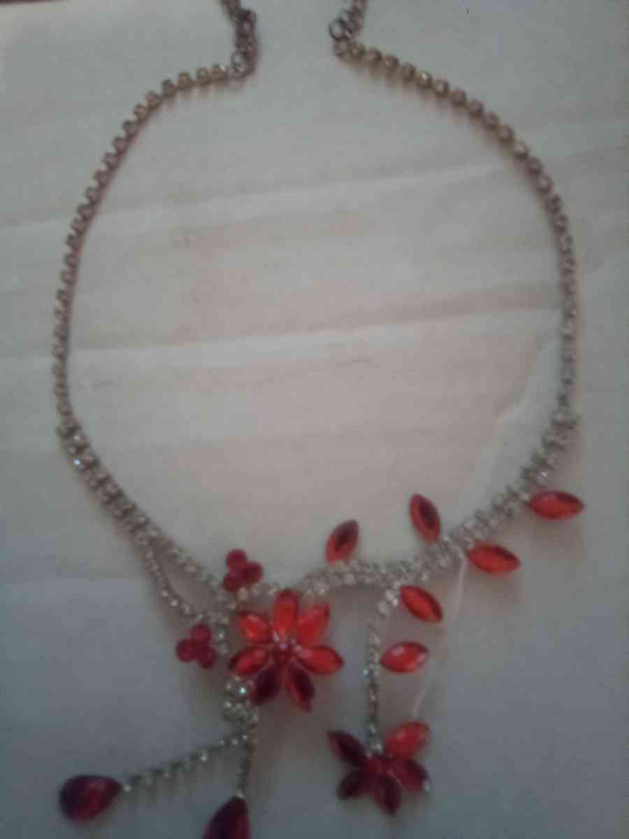Orange hanging flower and gold necklace with diamonds